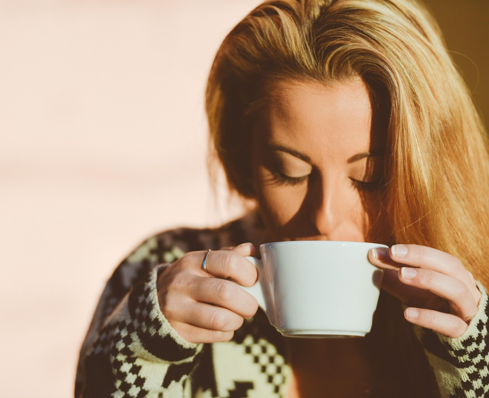 calm woman drinking tea