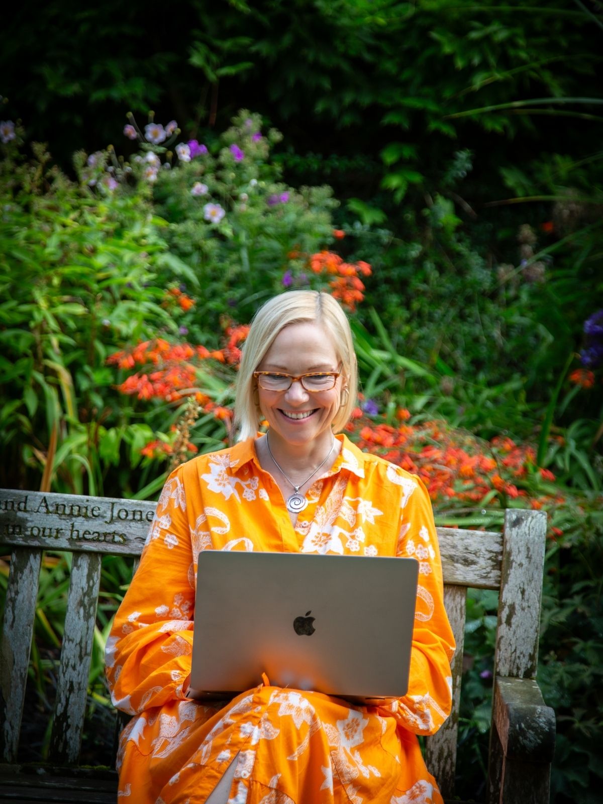 Cathy outside on a Zoom call with a client